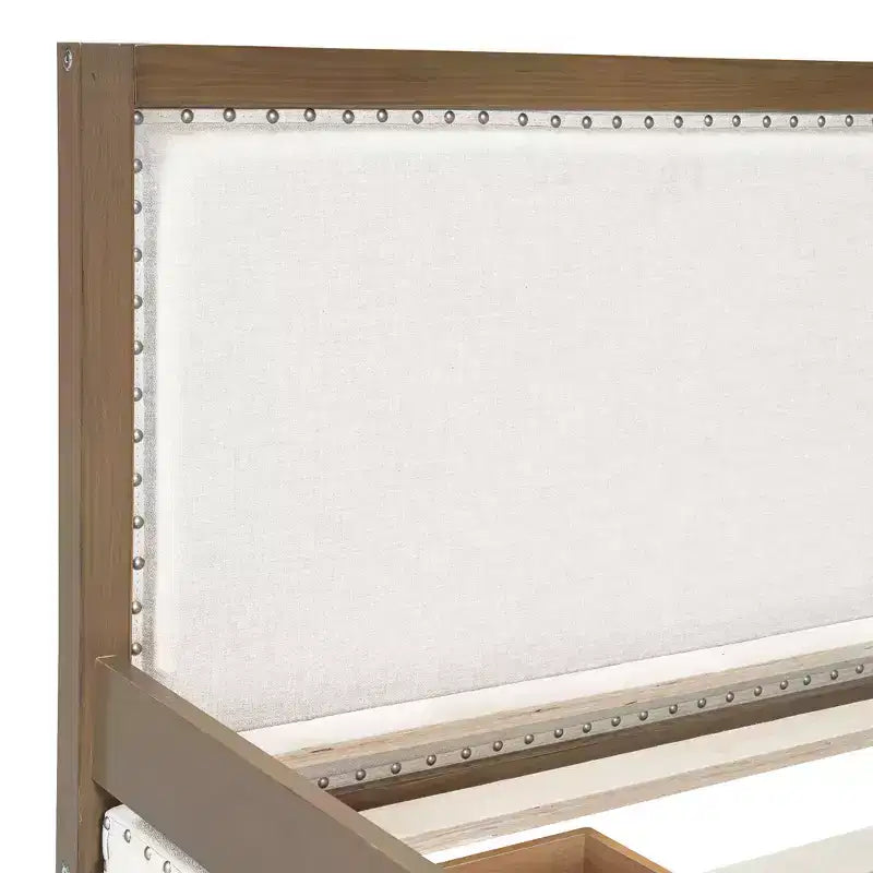 Letto a una piazza e mezza imbottito con letto estraibile e decorazione con borchie