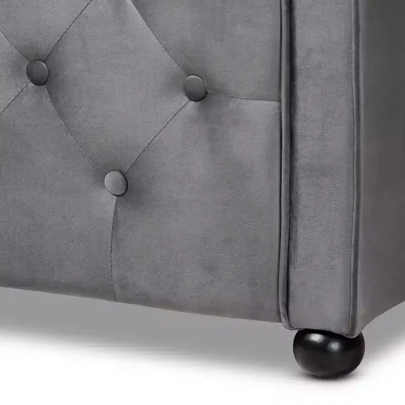 Divano letto Freda rivestito in tessuto velluto con bottoni capitonné - Baxton Studio