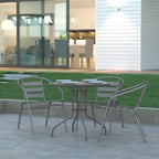 Tavolo rotondo Emma and Oliver 31.5 in metallo e vetro temperato con superficie liscia dal design a increspature